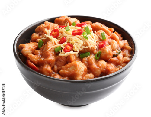 Bowl with delicious turkey chili on white background