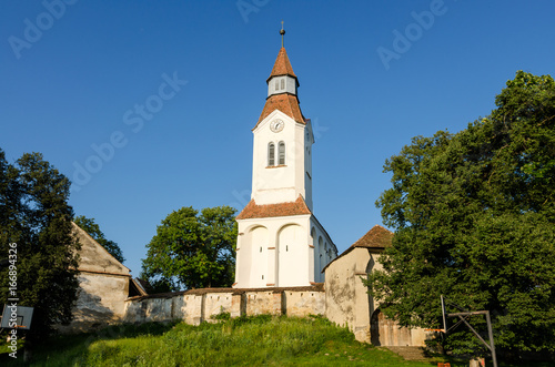 Fortified church in the Bunesti village, Romania photo