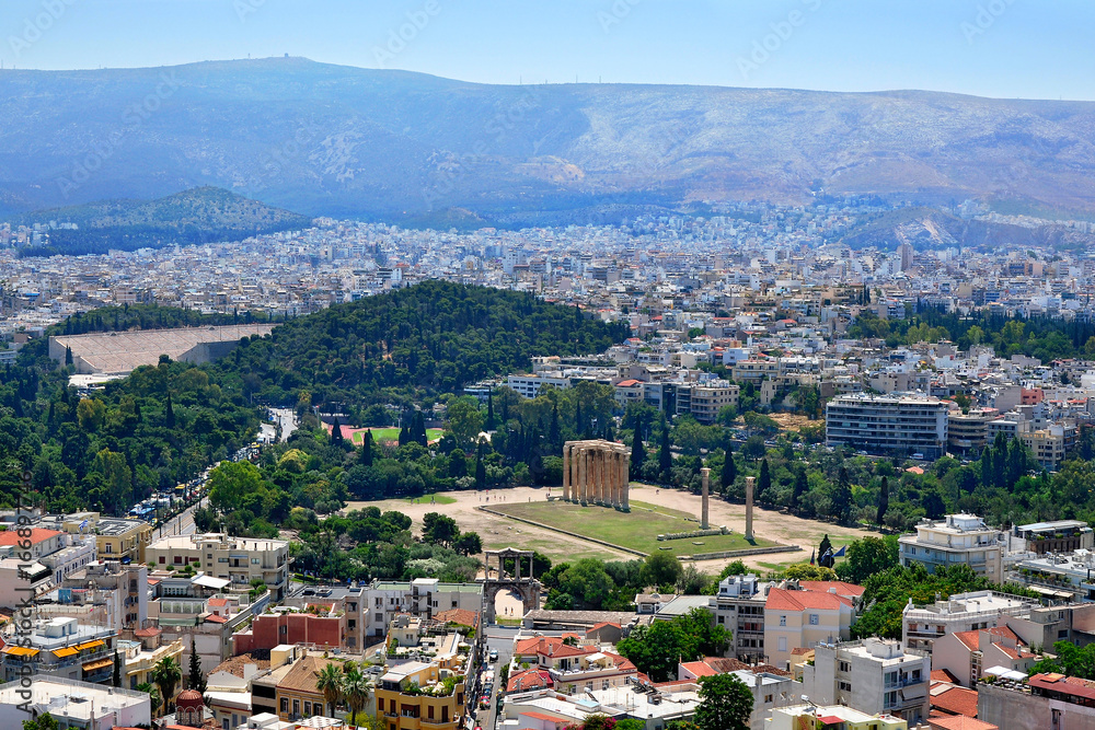 Panoramic view of Athens and the famous temple of Olympian Zeus from the Acropolis on a summer sunny day.