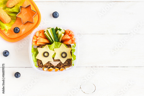 School lunch box for kids on white wooden background. Back to school. Top view, flat lay, copy space