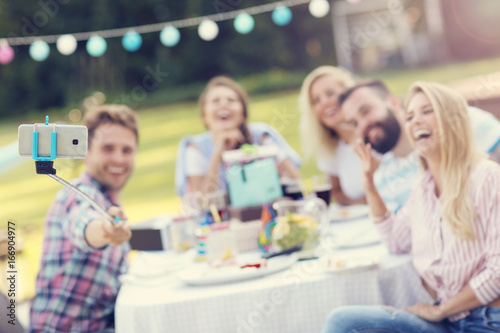 Group of friends having fun at birthday party