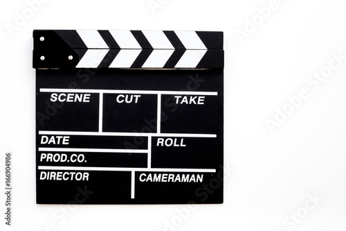 Filmmaker profession. Clapperboard on white background top view