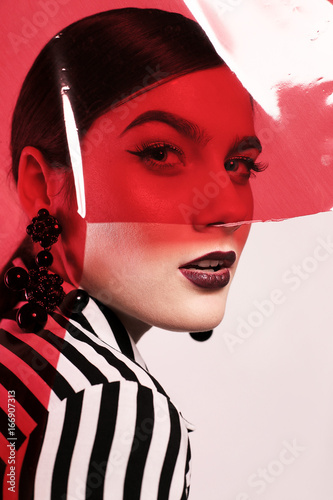 gorgeous woman in extravagant photoshoot.