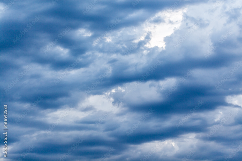 Sky with blue dark clouds