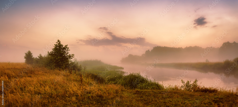 Obraz premium Misty river in the morning. Panorama. Warm summer morning