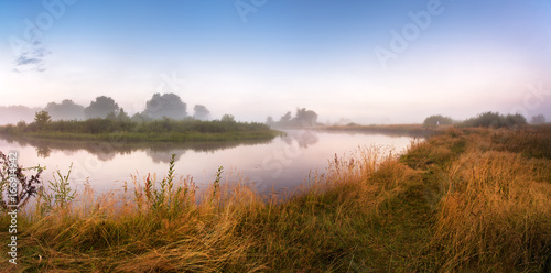 Foggy river in the morning. Panorama. Warm summer morning © NemanTraveler