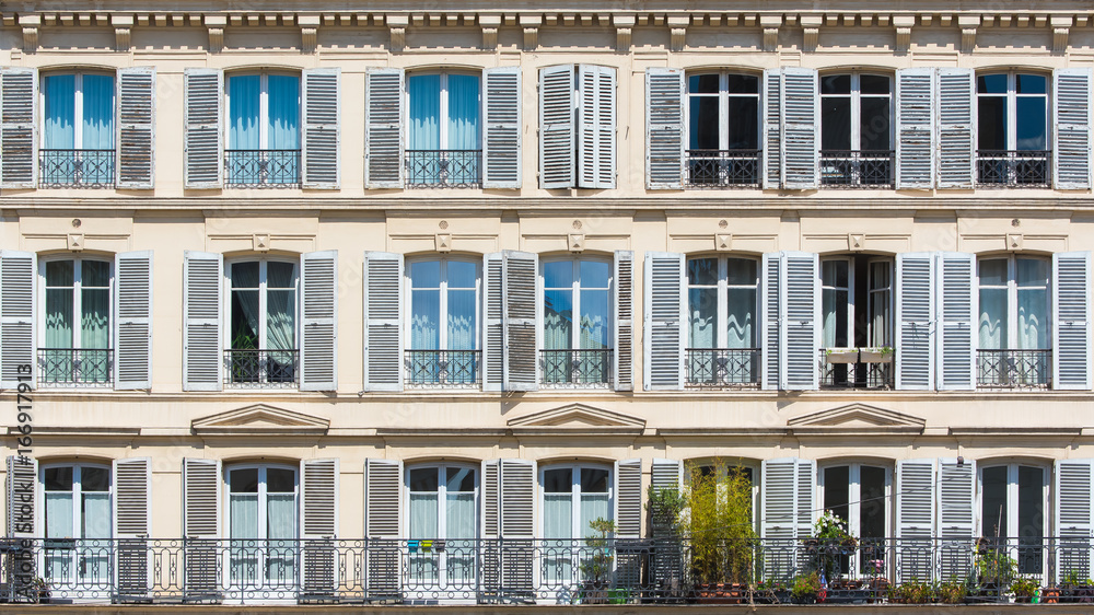 Paris, attractive facades with geometry of the parisian windows, the typical building of Paris
