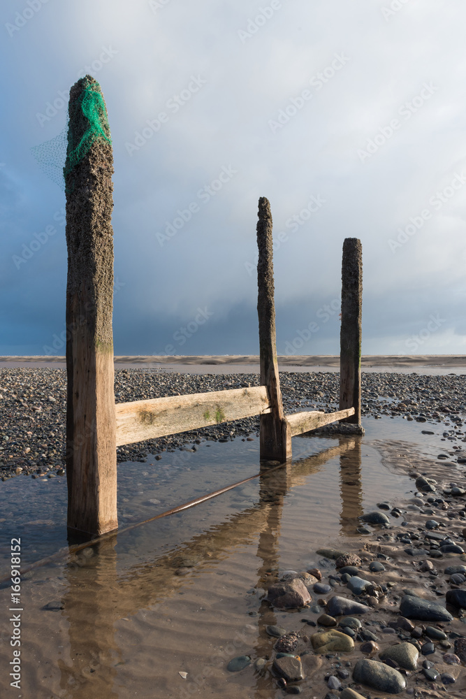 cleveleys, england, 02/17/2016, A rustic, weathered wooden sea defence wall, showing signs of damage... cleveleys, england, 02/17/2016, A rustic, weathered wooden sea defence wall, showing signs of damage...