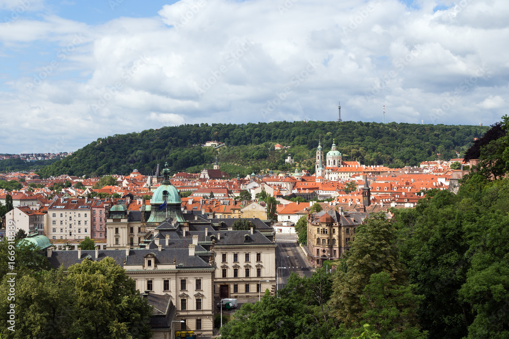 View of old buildings at the Mala Strana District (Lesser Town) and Petrin Hill in Prague, Czech Republic, in the daytime.