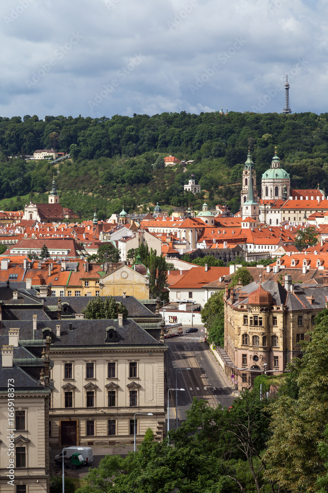 View of old buildings at the Mala Strana District (Lesser Town) and Petrin Hill in Prague, Czech Republic, in the daytime.