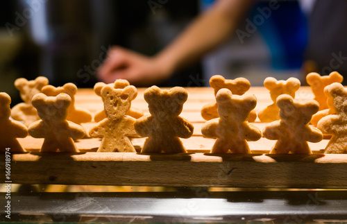 Lots of homemade little cookies in shape of bears in the bakery photo