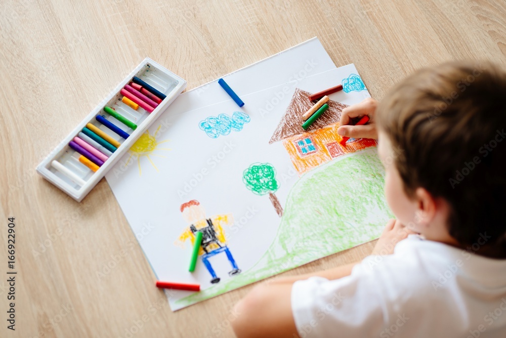 Child drawing picture of boy going to school. Child drawing picture of boy going to school.