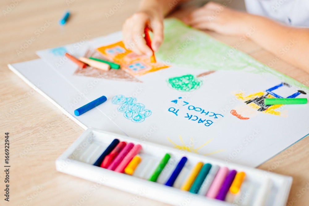 Child drawing picture of boy going to school. Child drawing picture of boy going to school.