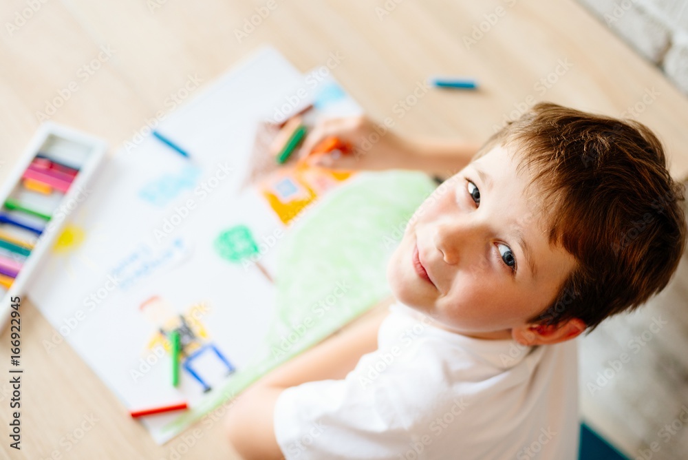 Child drawing picture of boy going to school. Child drawing picture of boy going to school.