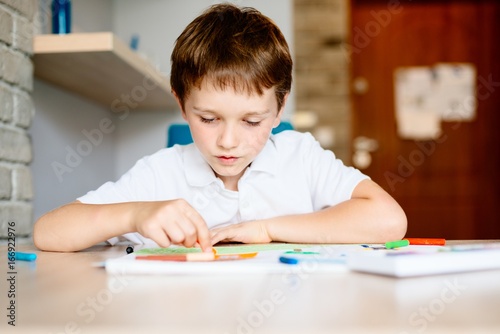 Seven years old boy drawing a picture