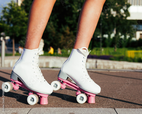 Close-up Of Legs Wearing Roller Skating Shoe, Outdoors