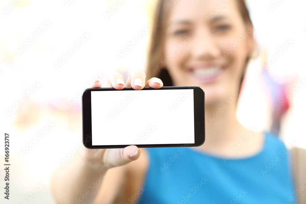 Female showing a blank horizontal phone screen