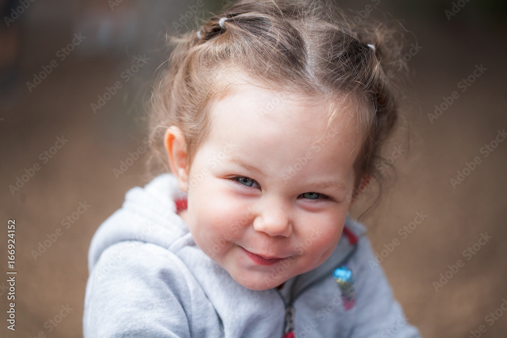 A portrait of a little pretty girl smiling A portrait of a little pretty girl smiling