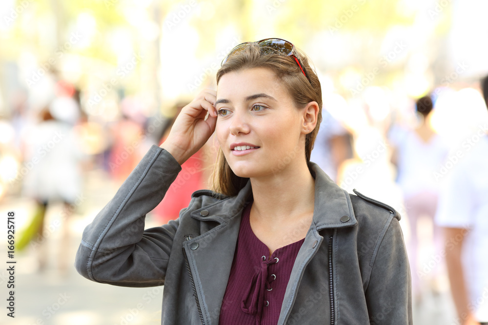Portrait of a pretty teen walking on the street Portrait of a pretty teen walking on the street