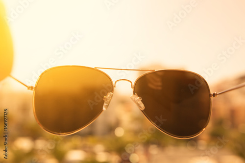 Sunglasses in hand 