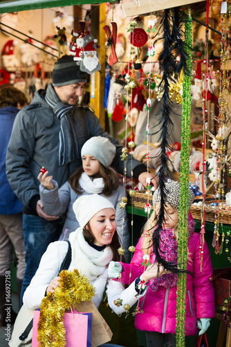 Family purchasing Christmas decoration and souvenirs