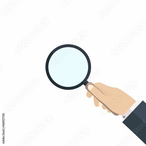 Hand with magnifying glass. Concept of searching, audit, analysis, exploration, scrutiny