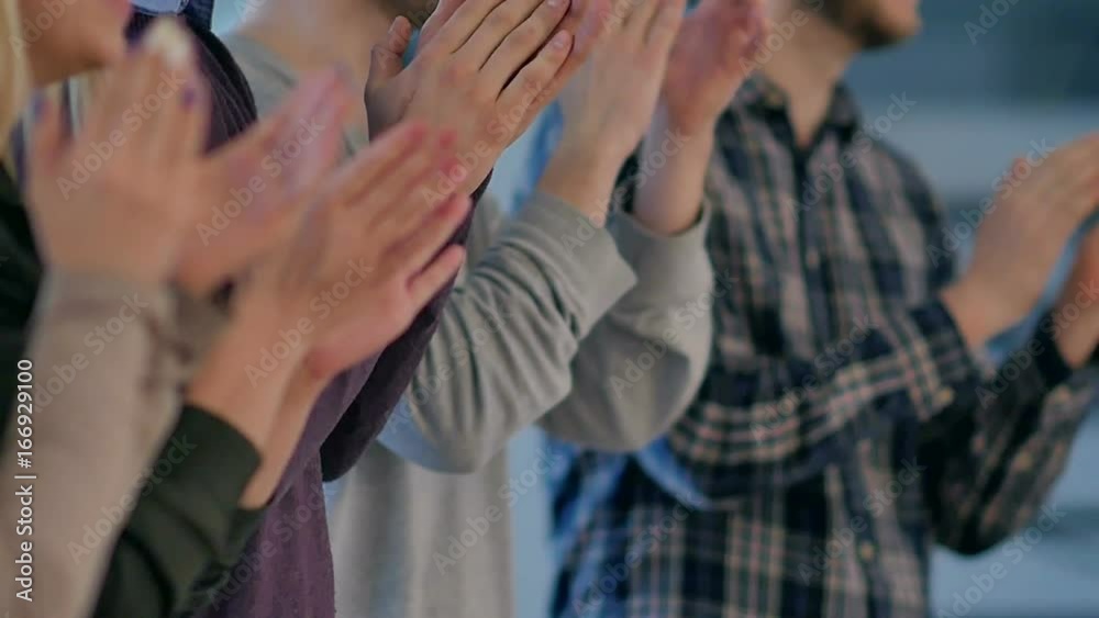 Satisfied proud business team clapping hands