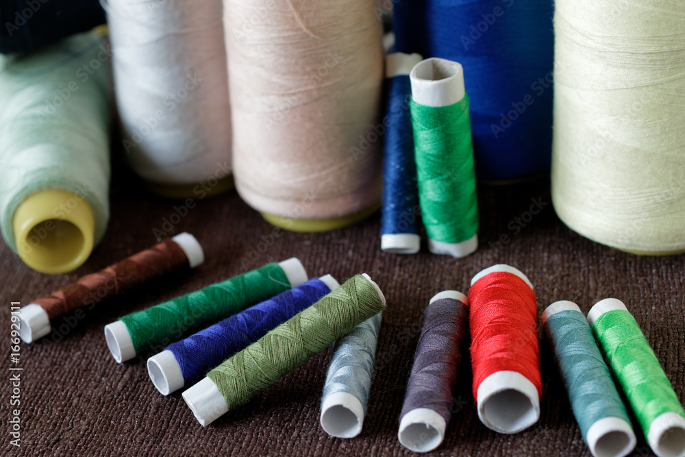 Colorful thread spools used in fabric and textile industry Colorful thread spools used in fabric and textile industry