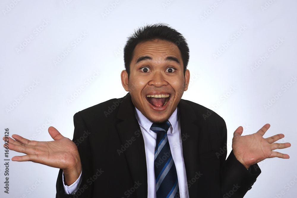 Photo image of a handsome attractive young Asian businessman with very happy gesture isolated on white Photo image of a handsome attractive young Asian businessman with very happy gesture isolated on white