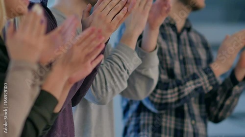 Satisfied proud business team clapping hands