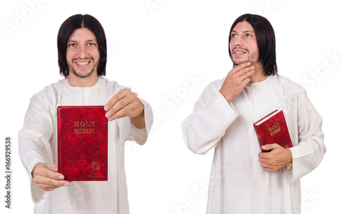 Young priest with bible isolated on white