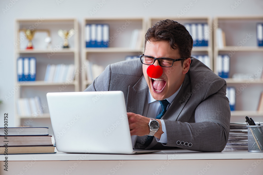 Clown businessman working in the office Clown businessman working in the office