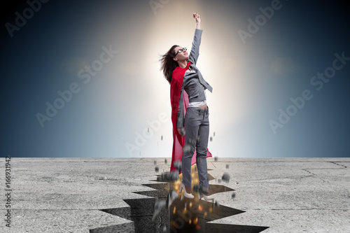 Fotografie Superhero businesswoman escaping from difficult situation