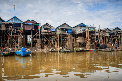 Cambodian river houses on stilts form an entire village.