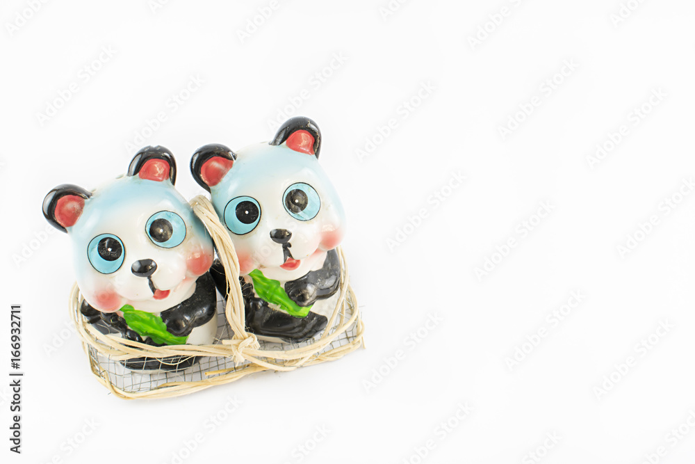 Fototapeta premium Salt and pepper bowl with a teddy bear.
