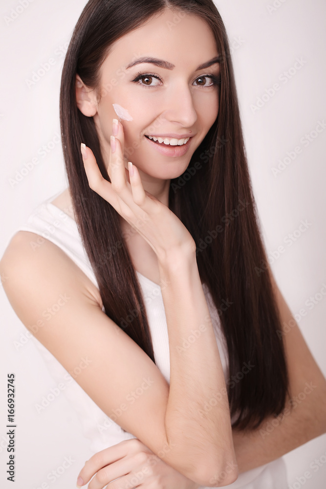 A beautiful woman asia using a skin care product, moisturizer or lotion and Skincare taking care of her dry complexion. Moisturizing cream in female hands A beautiful woman asia using a skin care product, moisturizer or lotion and Skincare taking care of her dry complexion. Moisturizing cream in female hands