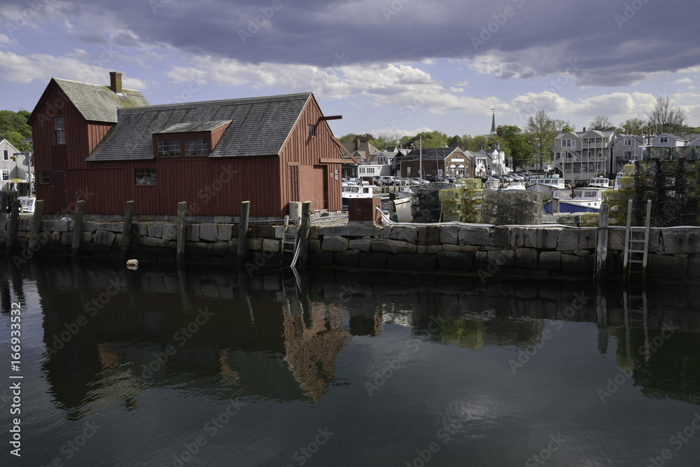 Rockport Massachusetts waterfront with red building and reflections
