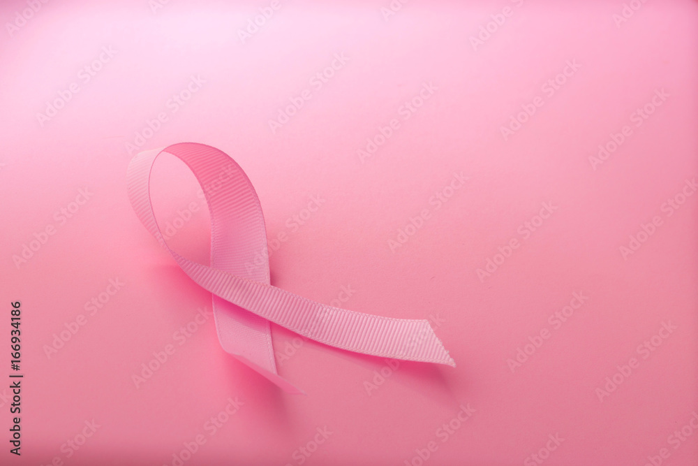 The Sweet pink ribbon shape on pink background paper for Breast Cancer Awareness symbol to promote  in october month campaign