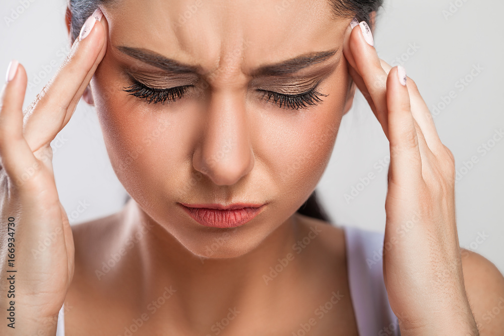 Health And Pain. Stressed Exhausted Young Woman Having Strong Tension Headache. Closeup Portrait Of Beautiful Sick Girl Suffering From Head Migraine, Feeling Pressure And Stress. High Resolution Image Health And Pain. Stressed Exhausted Young Woman Having Strong Tension Headache. Closeup Portrait Of Beautiful Sick Girl Suffering From Head Migraine, Feeling Pressure And Stress. High Resolution Image