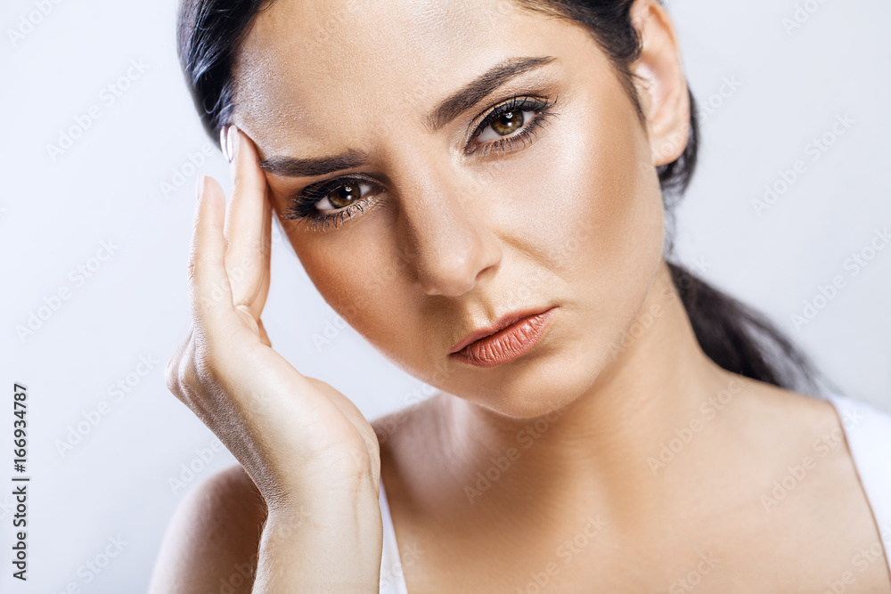 Health And Pain. Stressed Exhausted Young Woman Having Strong Tension Headache. Closeup Portrait Of Beautiful Sick Girl Suffering From Head Migraine, Feeling Pressure And Stress. High Resolution Image Health And Pain. Stressed Exhausted Young Woman Having Strong Tension Headache. Closeup Portrait Of Beautiful Sick Girl Suffering From Head Migraine, Feeling Pressure And Stress. High Resolution Image