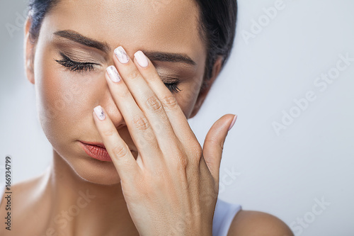 Health And Pain. Stressed Exhausted Young Woman Having Strong Tension Headache. Closeup Portrait Of Beautiful Sick Girl Suffering From Head Migraine, Feeling Pressure And Stress. High Resolution Image