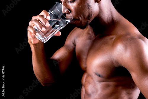 man big muscles with water glass