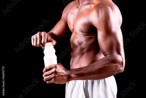 man big muscles with milk bottle
