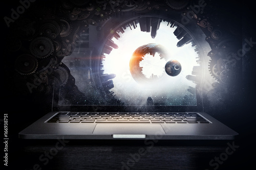 Laptop and construction concept. Mixed media photo