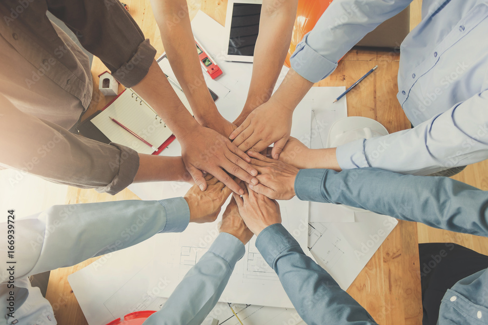 Engineer and Architect concept, Engineer Architects office team working and discussing house plan with blueprints and house model, Vintage Effect