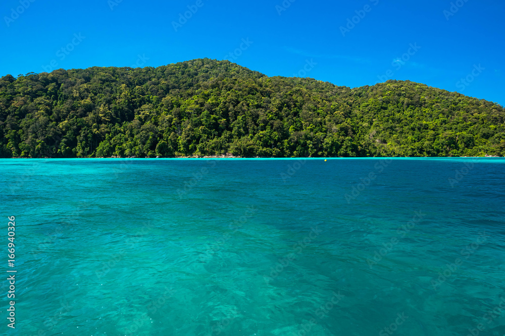 Blue and bright sea water surface at the sea, Beautiful blue sea at Surin island, Thailand