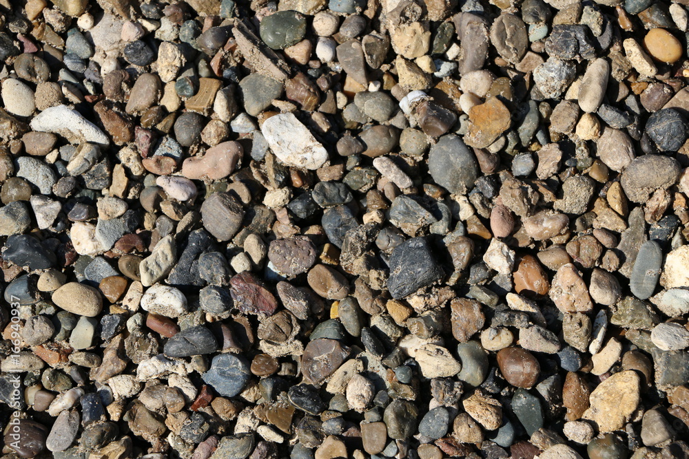Texture of natural stone - multi-colored pebbles - different-sized stones