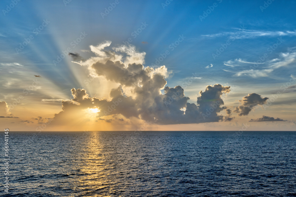 Crepuscular rays radiate from the sun