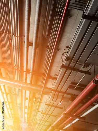 pipe line and electrical engineering pipe

red water pipe line and electrical electrical system in building, cable wiring. Mechanical engineering pipe. Electrical line. Communication cable.
