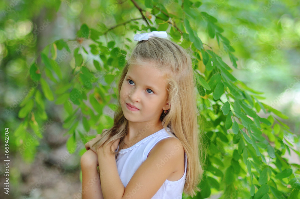 Portrait of a little girl on a green background. Portrait of a little girl on a green background.